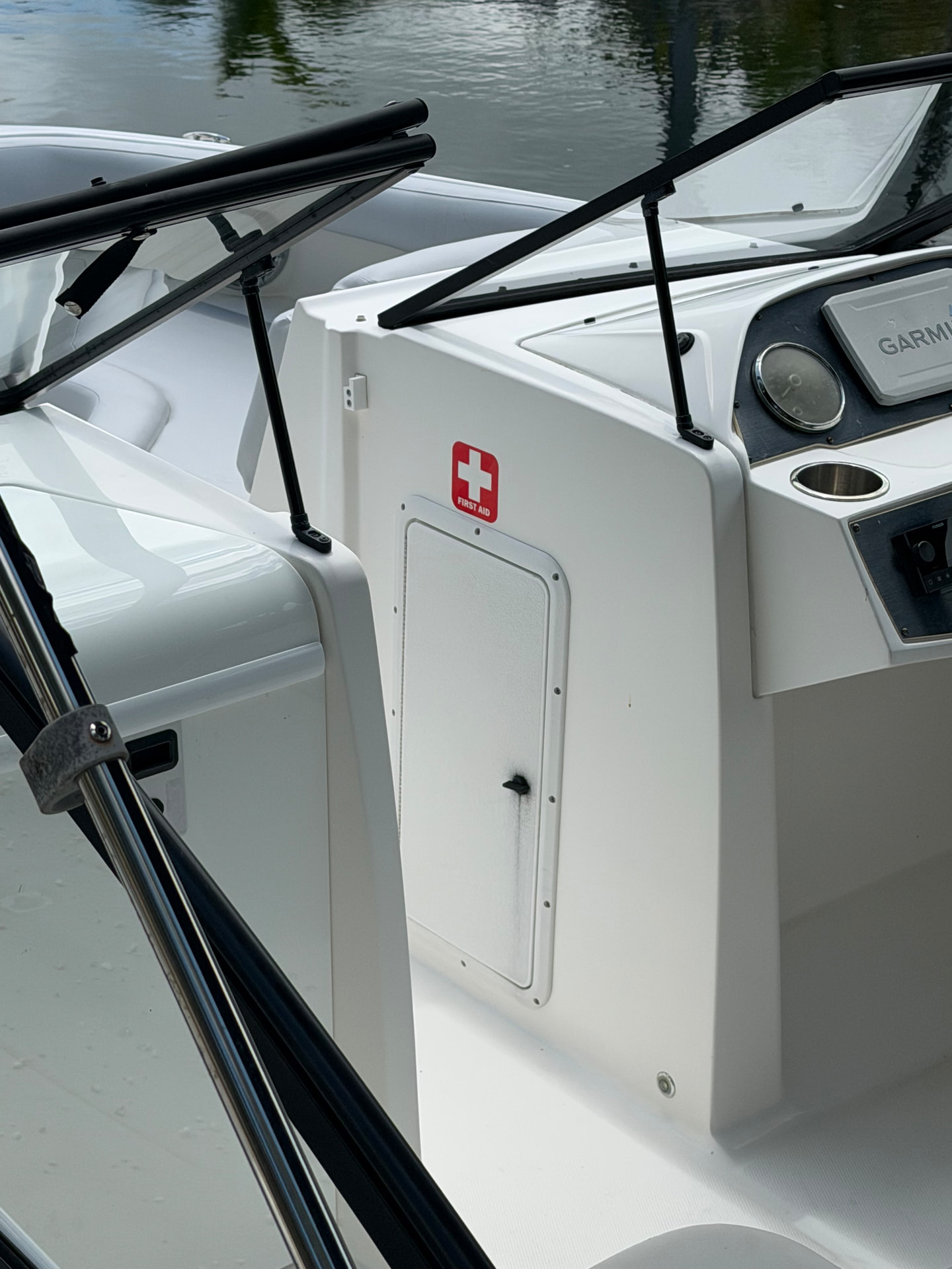 Helm console with Garmin electronics and first aid kit